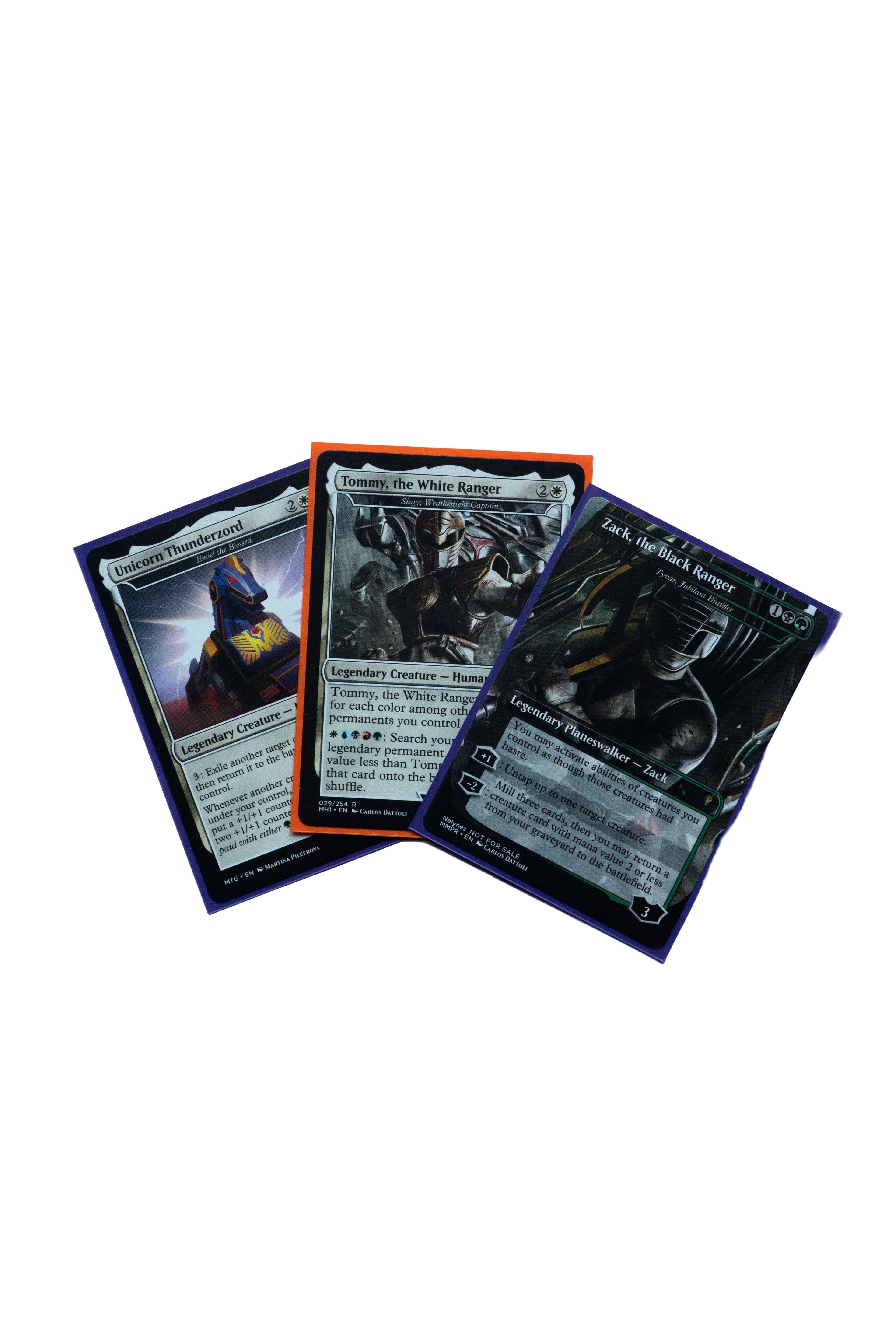 Three custom Power Rangers Magic cards featuring Tommy, Zack, and the Unicorn Thunderzord.