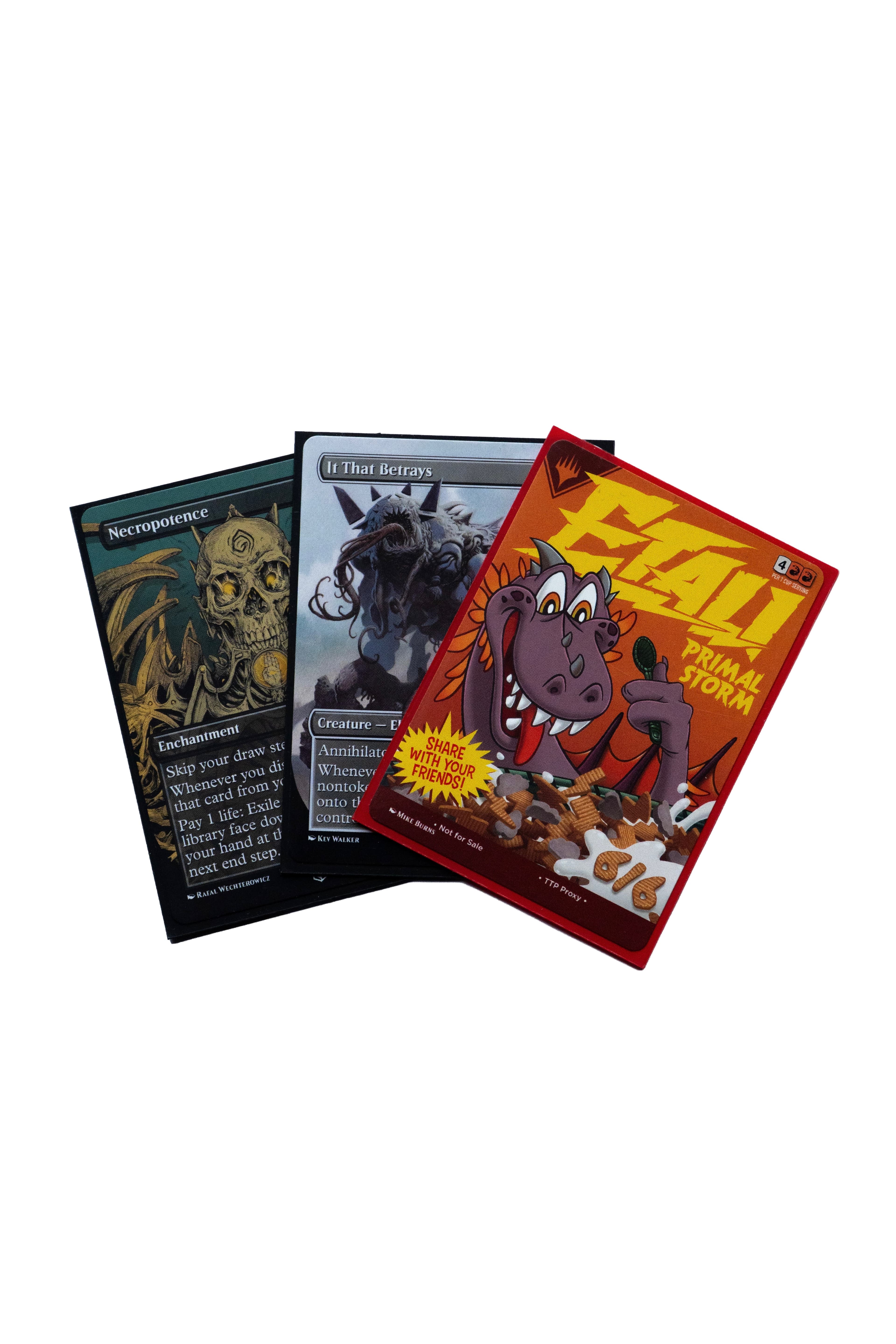 Three Magic: The Gathering cards, featuring Necropotence, It That Betrays, and a cereal-themed Etali.